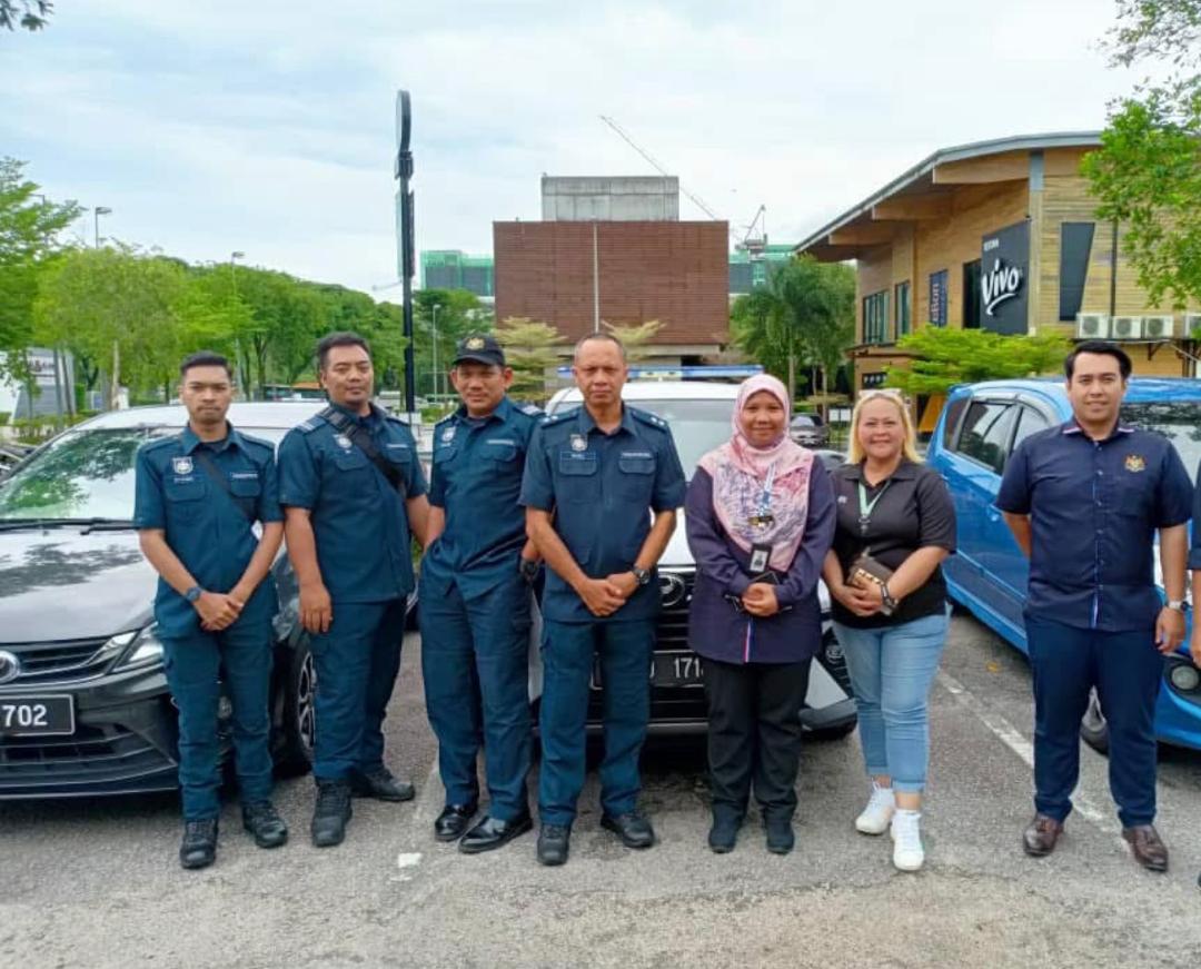 Nelfar Zulkifli with Commissioner of Buildings officers and colleagues before a joint visit