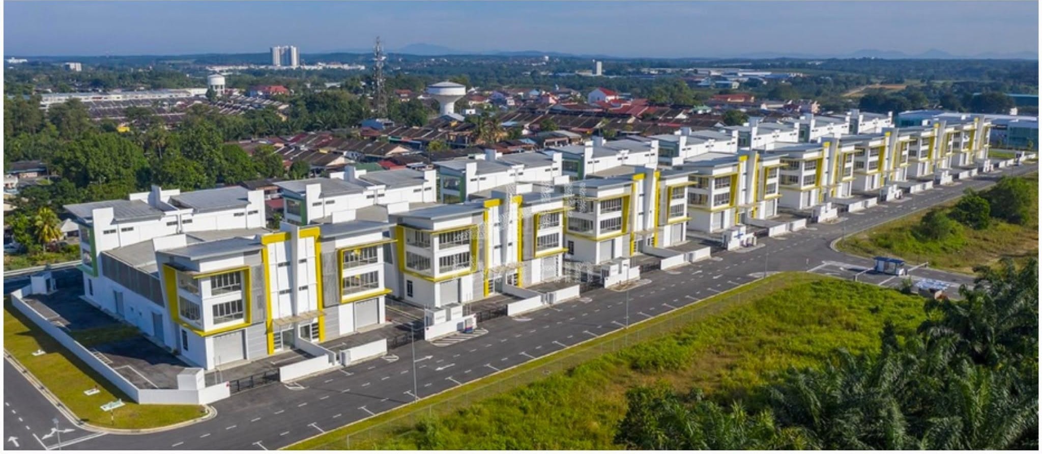 Aerial view of a row of semi-detached factory units on an industrial estate in Saleng, Senai
