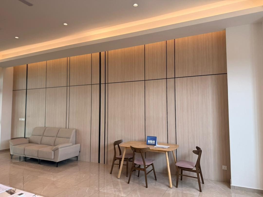 A seating area with sofa and table inside a management office