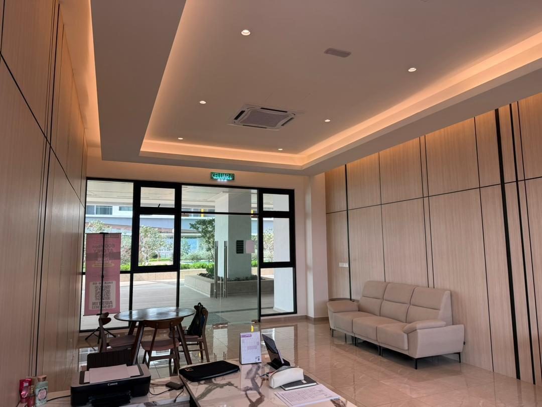 A timber-panelled reception area with equipment still on the counter during fit-out