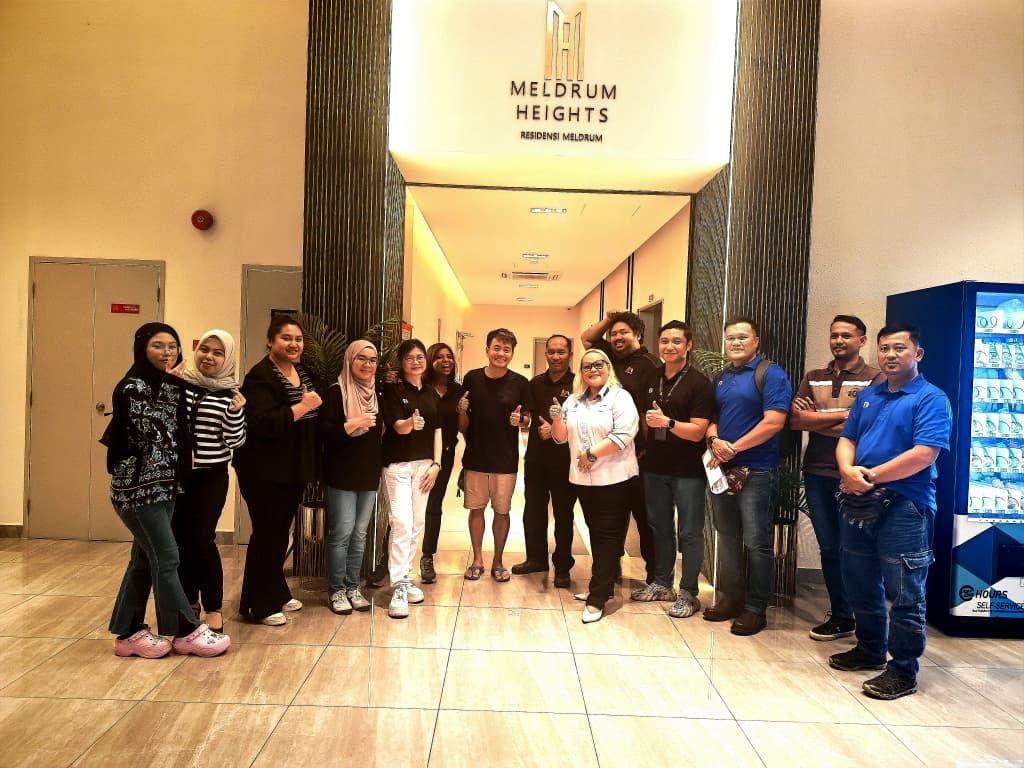 Nelfar Zulkifli and colleagues in the lobby at Meldrum Heights