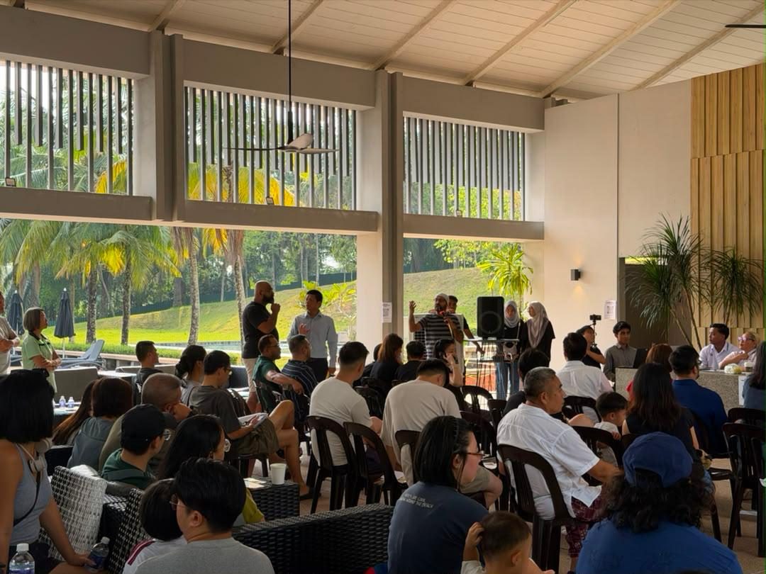 A full hall of seated owners at an annual general meeting