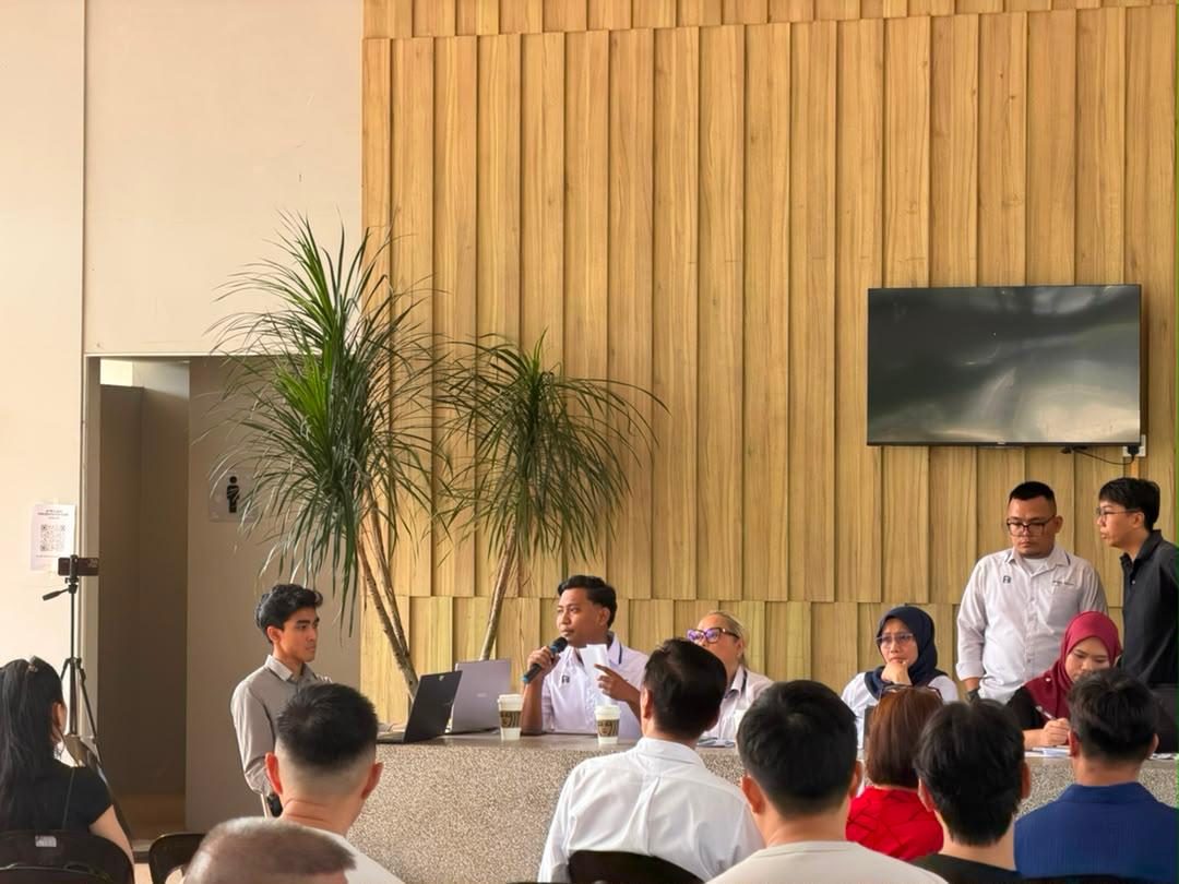 The chairman answering the floor from the top table at an annual general meeting