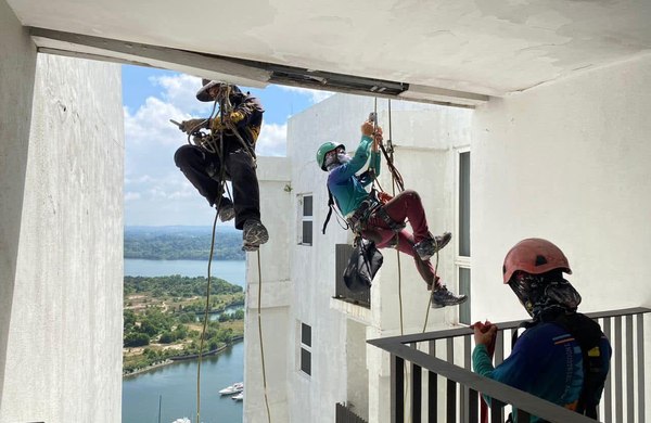 Rope-access technicians inspecting a high-rise façade